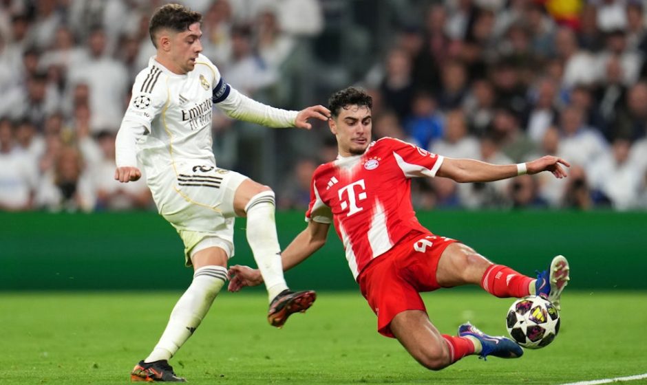 MADRID, SPAIN - APRIL 07: Aleksandar Pavlovic of FC Bayern Munich is challenged by Federico Valverde of Real Madrid during the UEFA Champions League 2025/26 Quarter-Final First Leg match between Real Madrid CF and FC Bayern München at Estadio Santiago Bernabeu on April 07, 2026 in Madrid, Spain. (Photo by Aitor Alcalde/Getty Images)